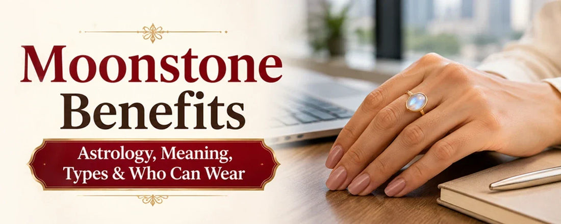 A hand wearing a glowing moonstone ring on a desk for moonstone benefits.